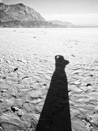 Shadow of a man on a beach