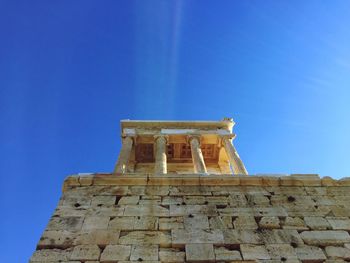 Low angle view of built structure against clear blue sky