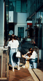 People sitting outside building