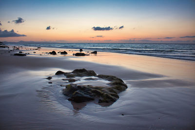 Scenic view of sea against sky during sunset