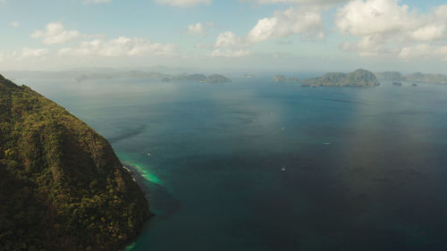 Seascape with tropical bay, rocky islands, ocean blue water, aerial view. 