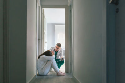 Rear view of woman standing in building