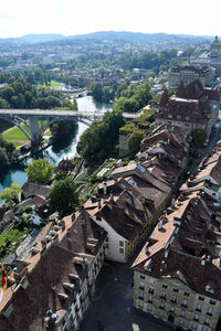 High angle view of townscape and river against sky