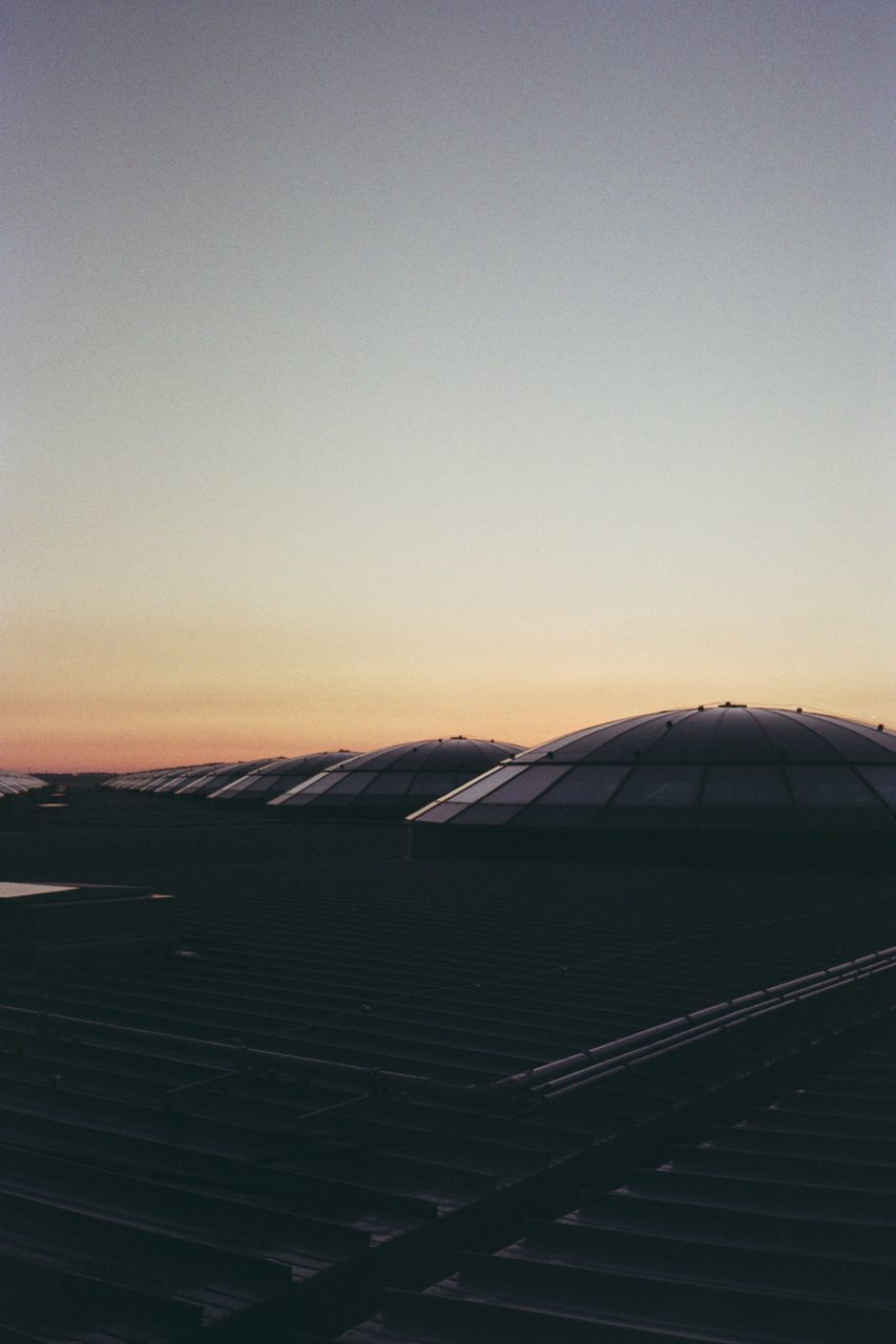 SCENIC VIEW OF LANDSCAPE AGAINST CLEAR SKY AT SUNSET