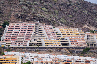 Aerial view at hillside full of vacation homes close together at canary island