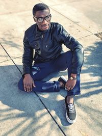 Portrait of young man sitting outdoors