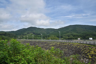 Scenic view of agricultural landscape against sky