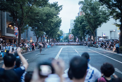 Group of people on road in city