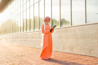 Full length of woman standing outdoors