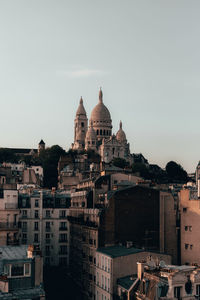 View of buildings in city against sky