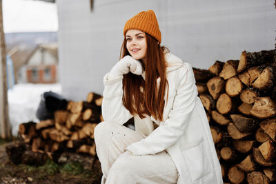 Portrait of smiling young woman standing in market