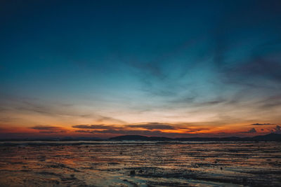 Scenic view of sea against sky at sunset