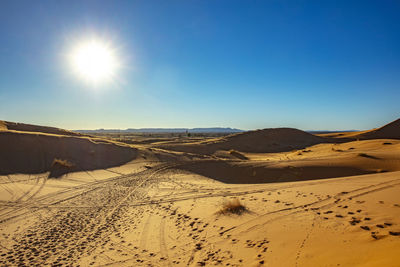 Scenic view of desert against clear sky