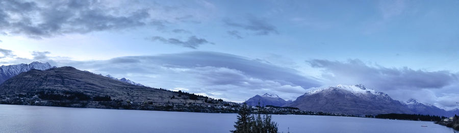 Scenic view of lake against sky during winter