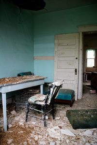 Damaged chairs in abandoned house