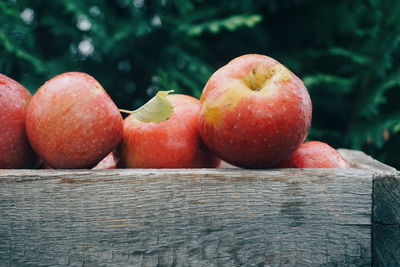 Close-up of apples in wooden container