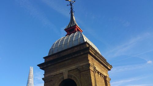 Low angle view of built structure against blue sky