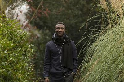 Portrait of young man standing on land