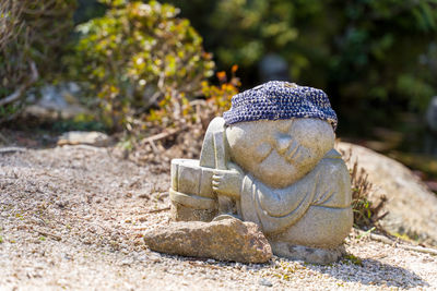 Close-up of statue against rock