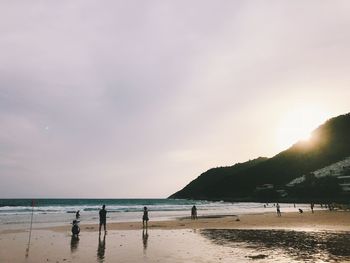 Scenic view of beach against sky during sunset
