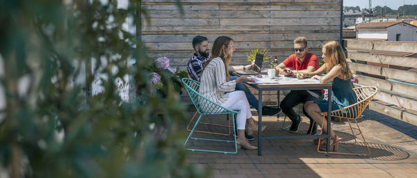 Group of office workers working on the terrace of the officce