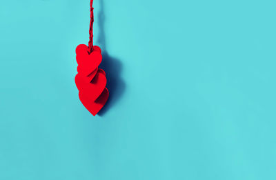 Close-up of heart shape against blue background