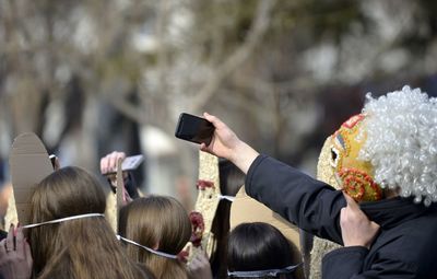 Rear view of woman photographing