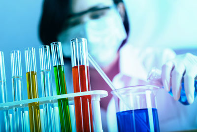 Female scientist holding medical sample at laboratory
