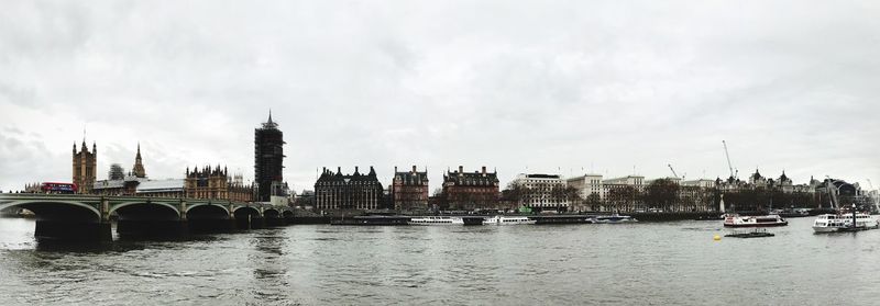 View of bridge over river against cloudy sky