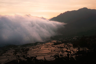 Scenic view of mountains against sky during sunset