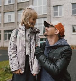 Portrait of smiling couple standing in park