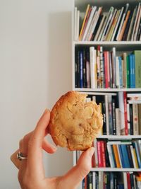 Close-up of person hand holding book