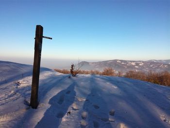 Snow covered mountain against clear sky
