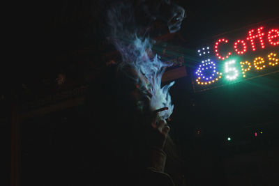 Illuminated fireworks against sky at night