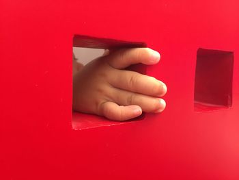 Child hiding in playhouse