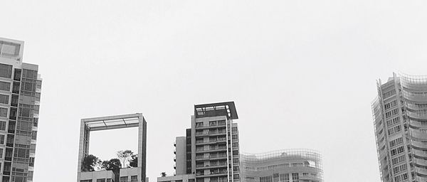 Skyscrapers in city against clear sky