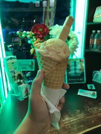 Close-up of hand holding ice cream