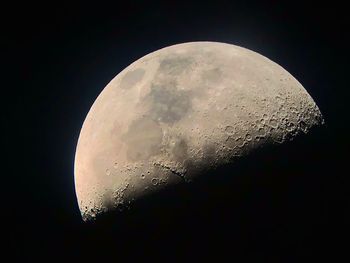 Close-up of moon over black background