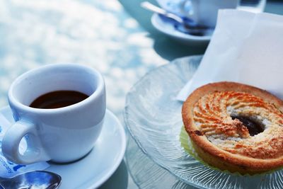 Close-up of coffee cup and dessert