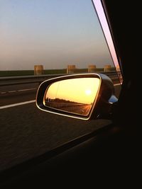 Reflection of car on side-view mirror