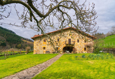 House on field against sky