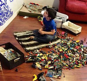 Full length of woman sitting on hardwood floor