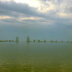 Scenic view of sea against cloudy sky