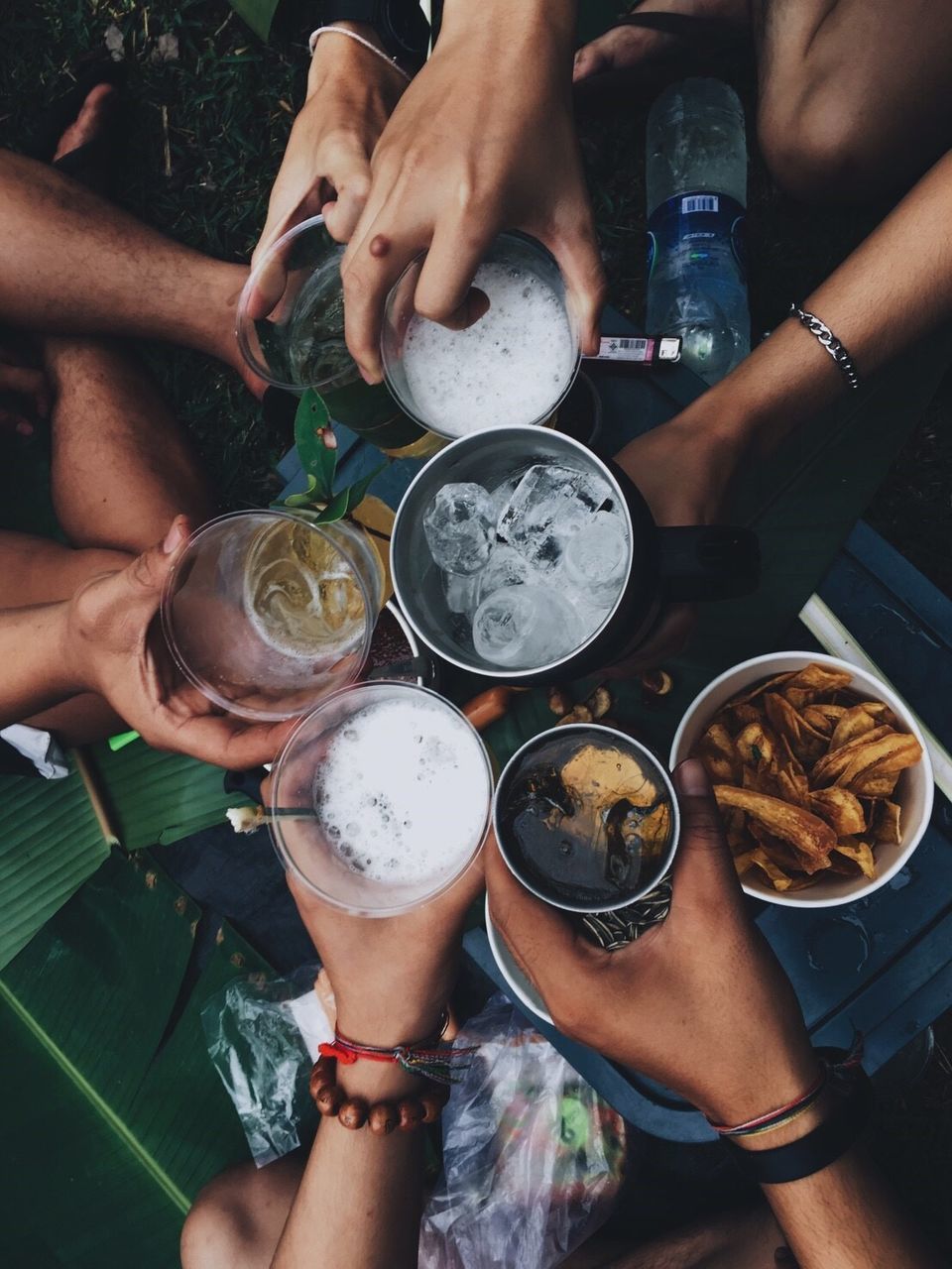 MIDSECTION OF WOMAN HOLDING DRINK WITH HANDS