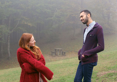 Side view of a smiling young couple