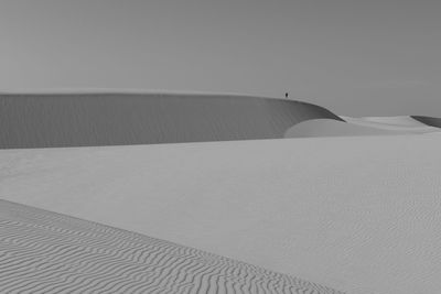 A man observes the dazzling lencois maranhenses