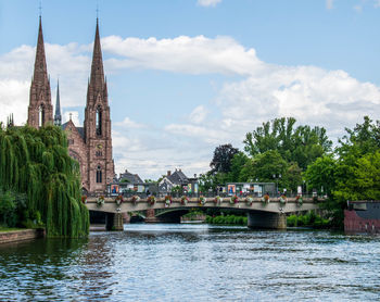 Panoramic view of river and buildings against sky