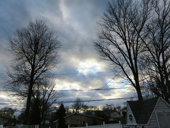 Low angle view of buildings against cloudy sky