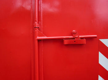 Close-up of closed red metallic door