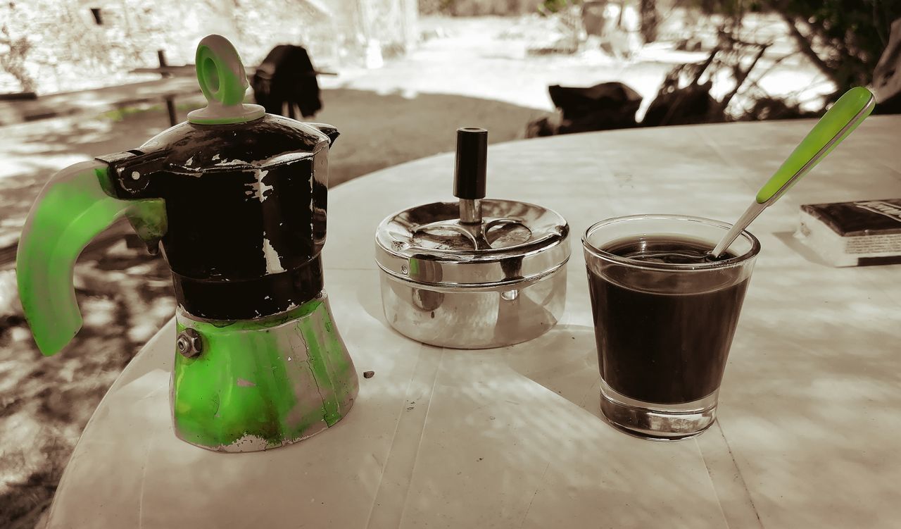 soft drink, food and drink, drink, table, no people, refreshment, focus on foreground, nature, black, household equipment, green, container, food, day, water, indoors, still life, wood, glass